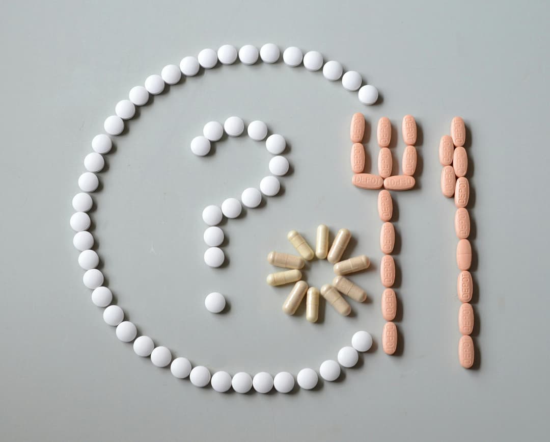 pills arranged to make a question mark